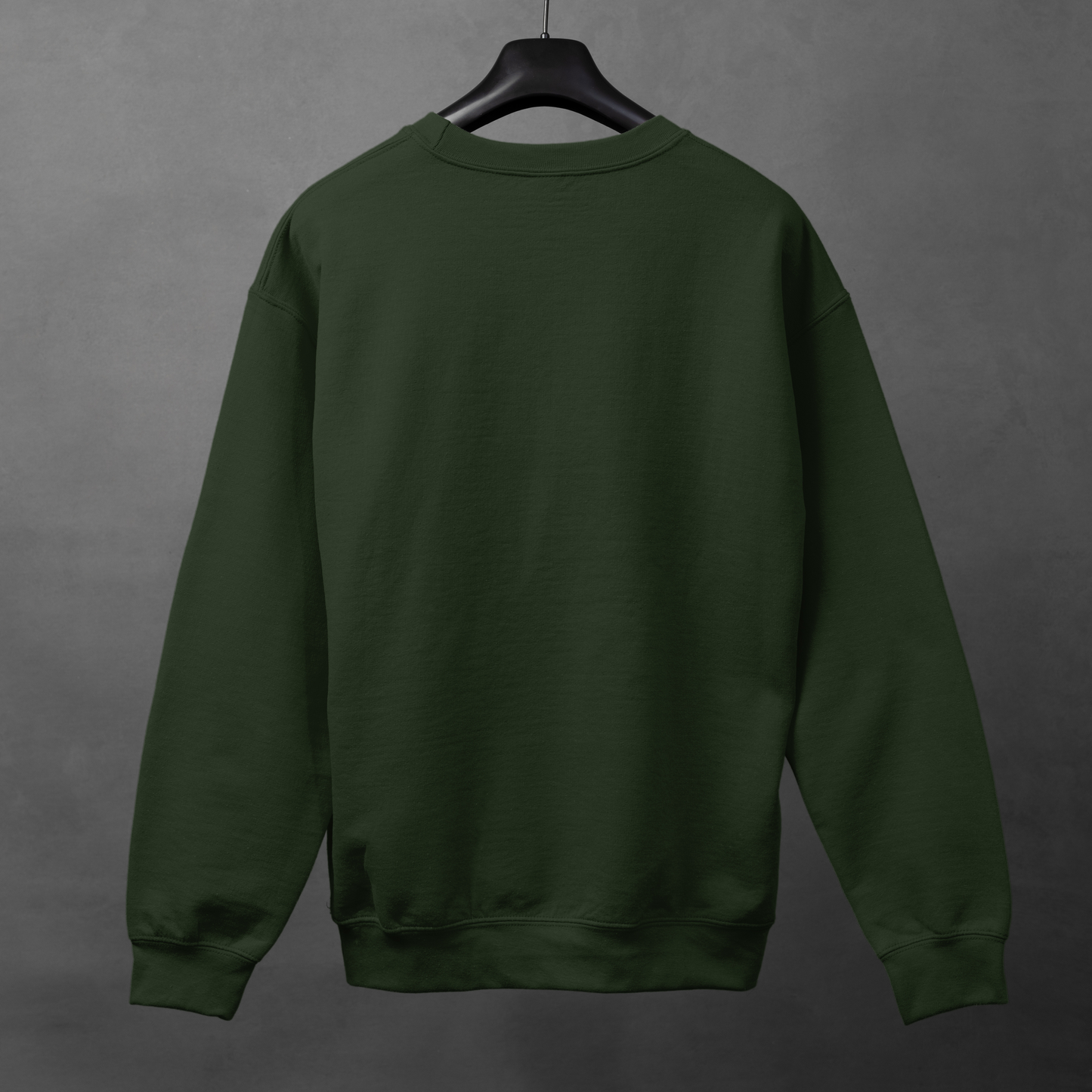 Green sweatshirt on a hanger against a gray background