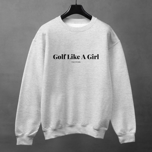 Gray sweatshirt with 'Golf Like A Girl' text on a hanger against a gray background