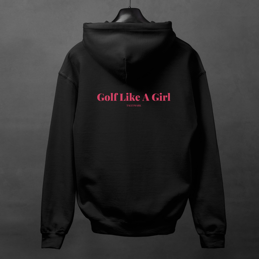 Black hoodie with pink "Golf Like A Girl" text on the back against a dark background