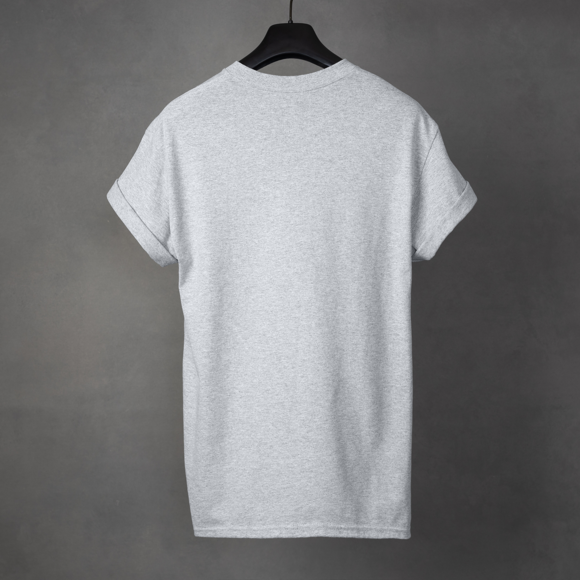Gray t-shirt on a hanger against a gray background
