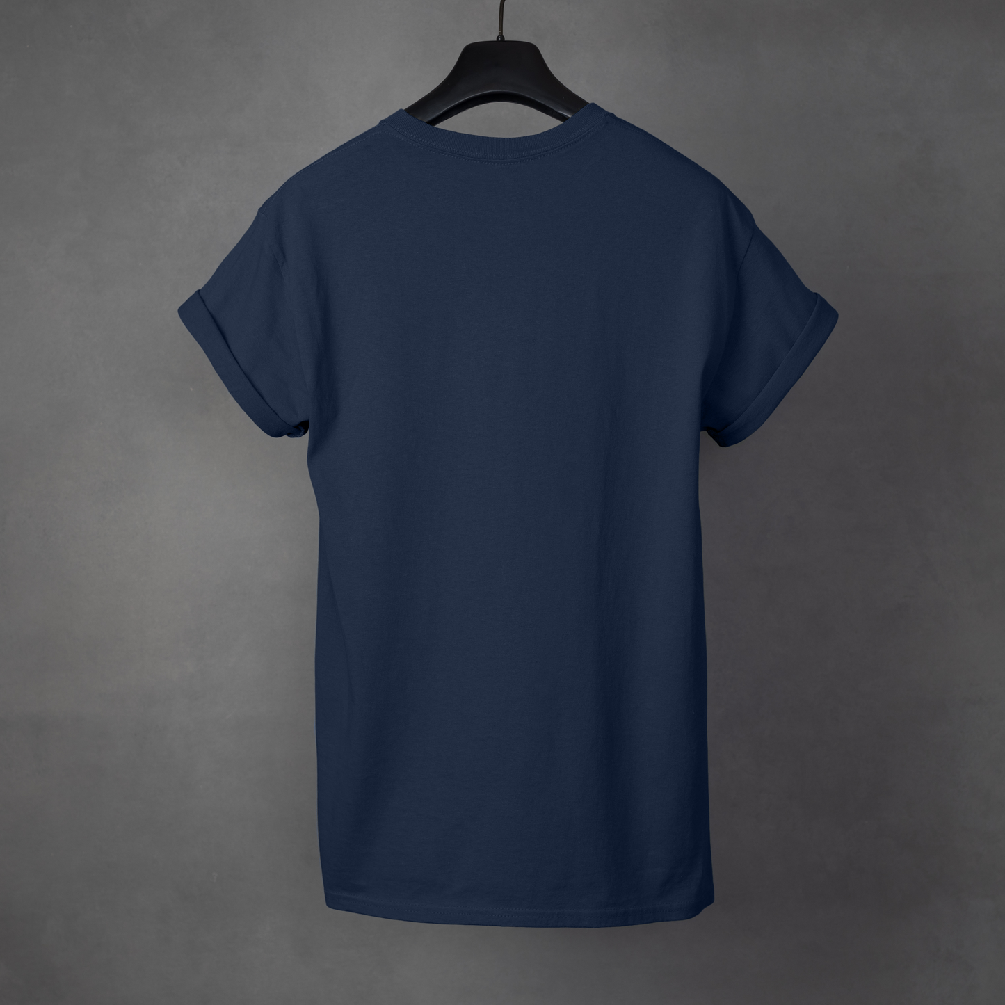 Navy blue t-shirt on a hanger against a gray background