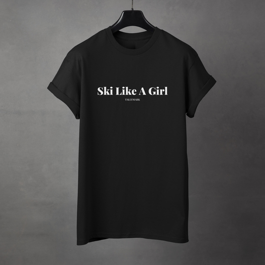 Black t-shirt with 'Ski Like A Girl' text on a gray background