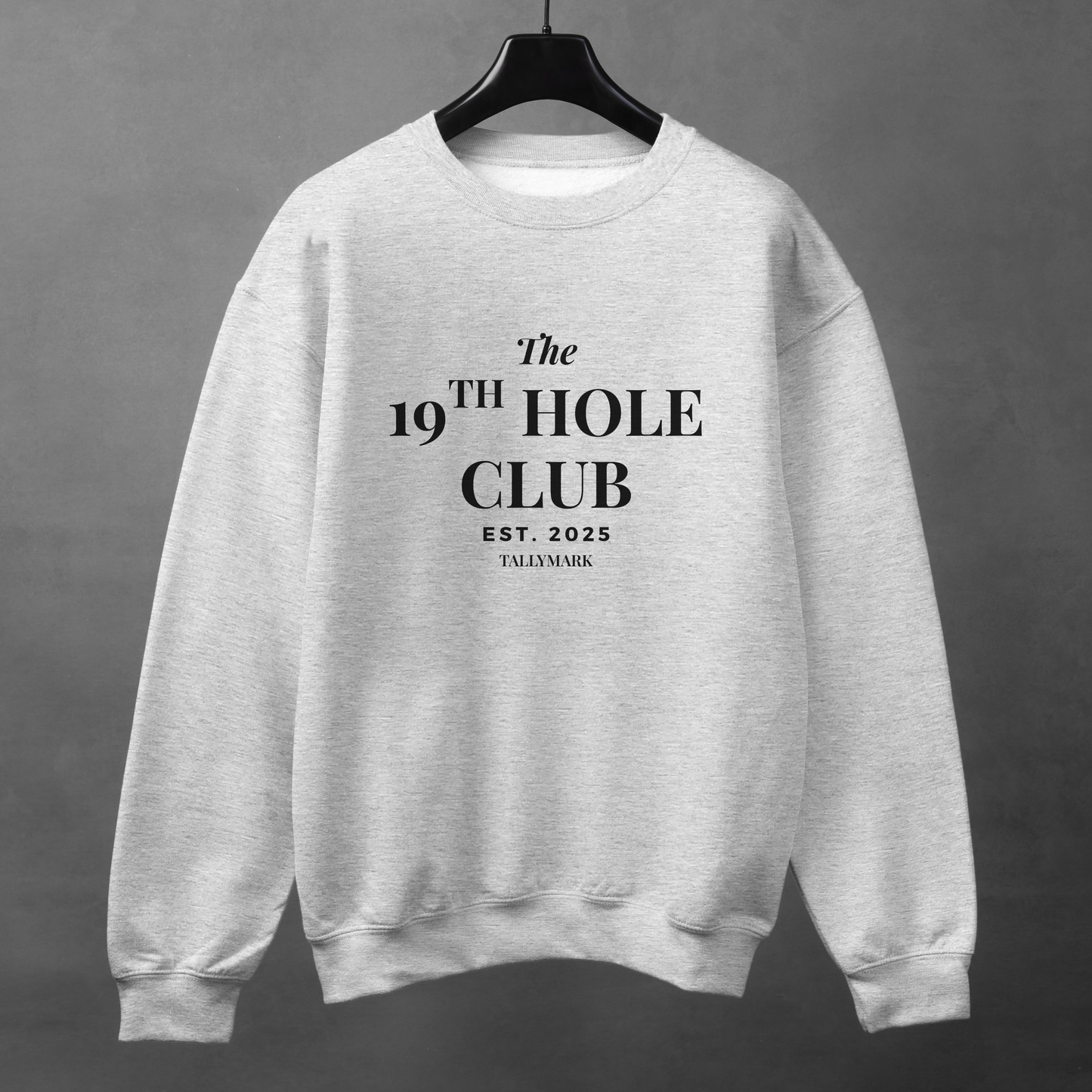 Gray sweatshirt with "The 19th Hole Club" text against a dark background