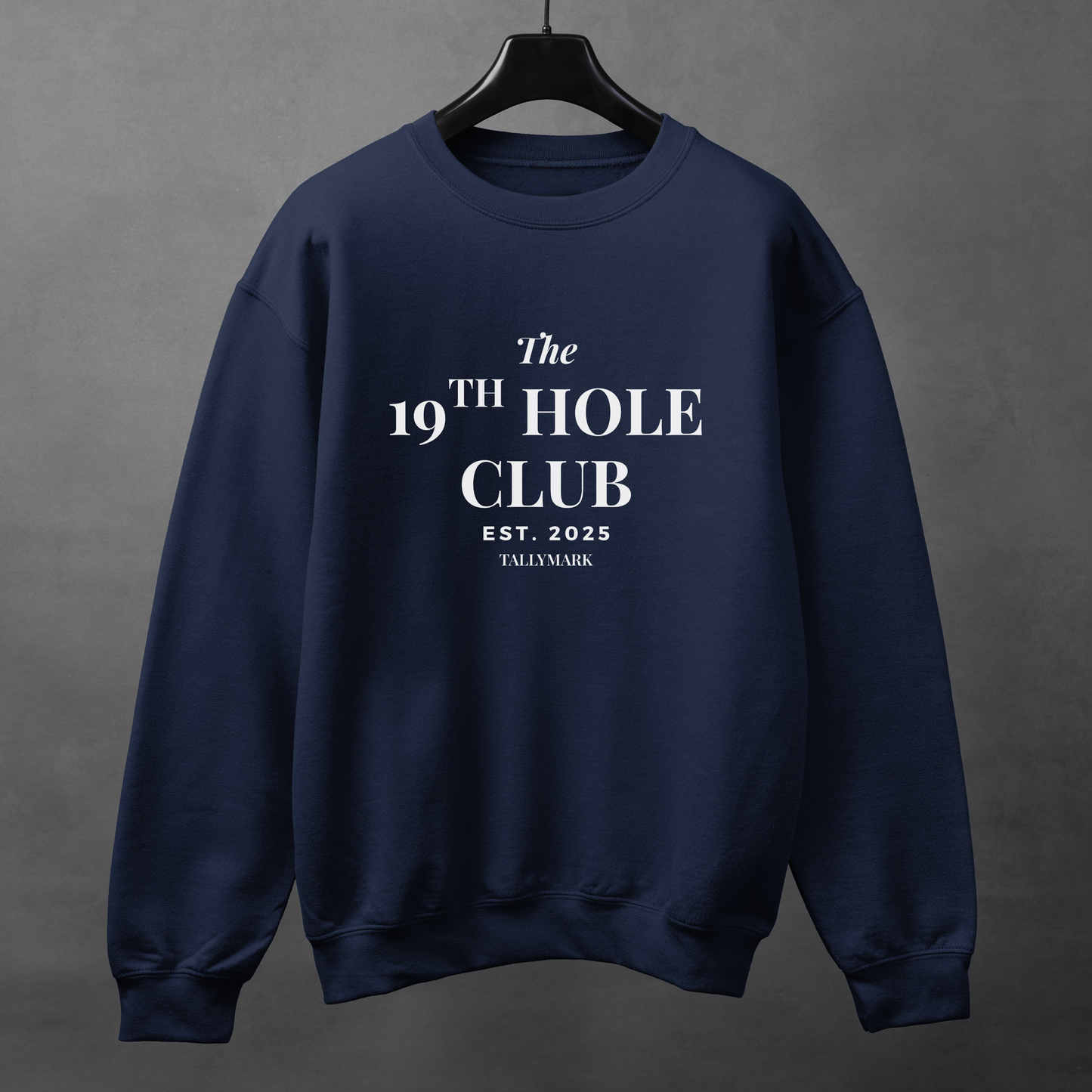 Navy blue sweatshirt with "The 19th Hole Club" text against a dark background