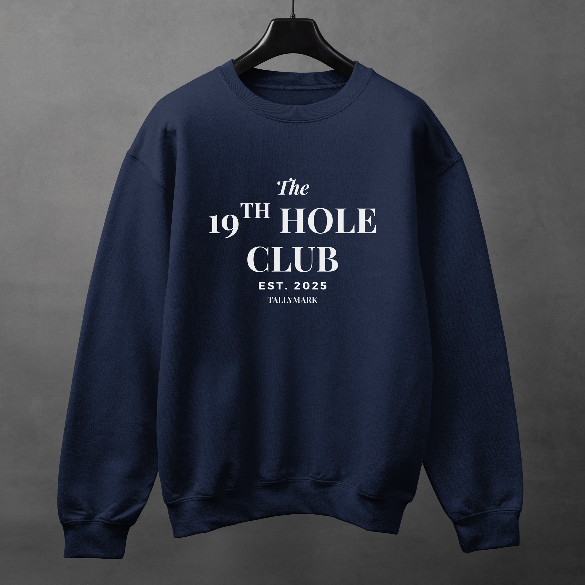 Navy blue sweatshirt with "The 19th Hole Club" text against a dark background