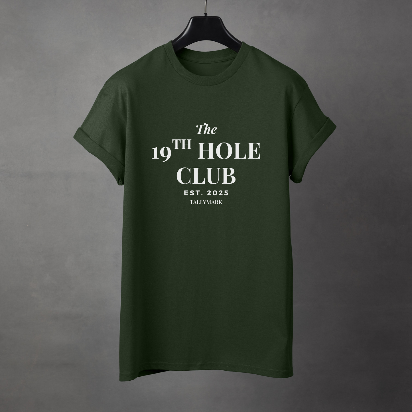 Green t-shirt with "The 19th Hole Club" text against a dark background