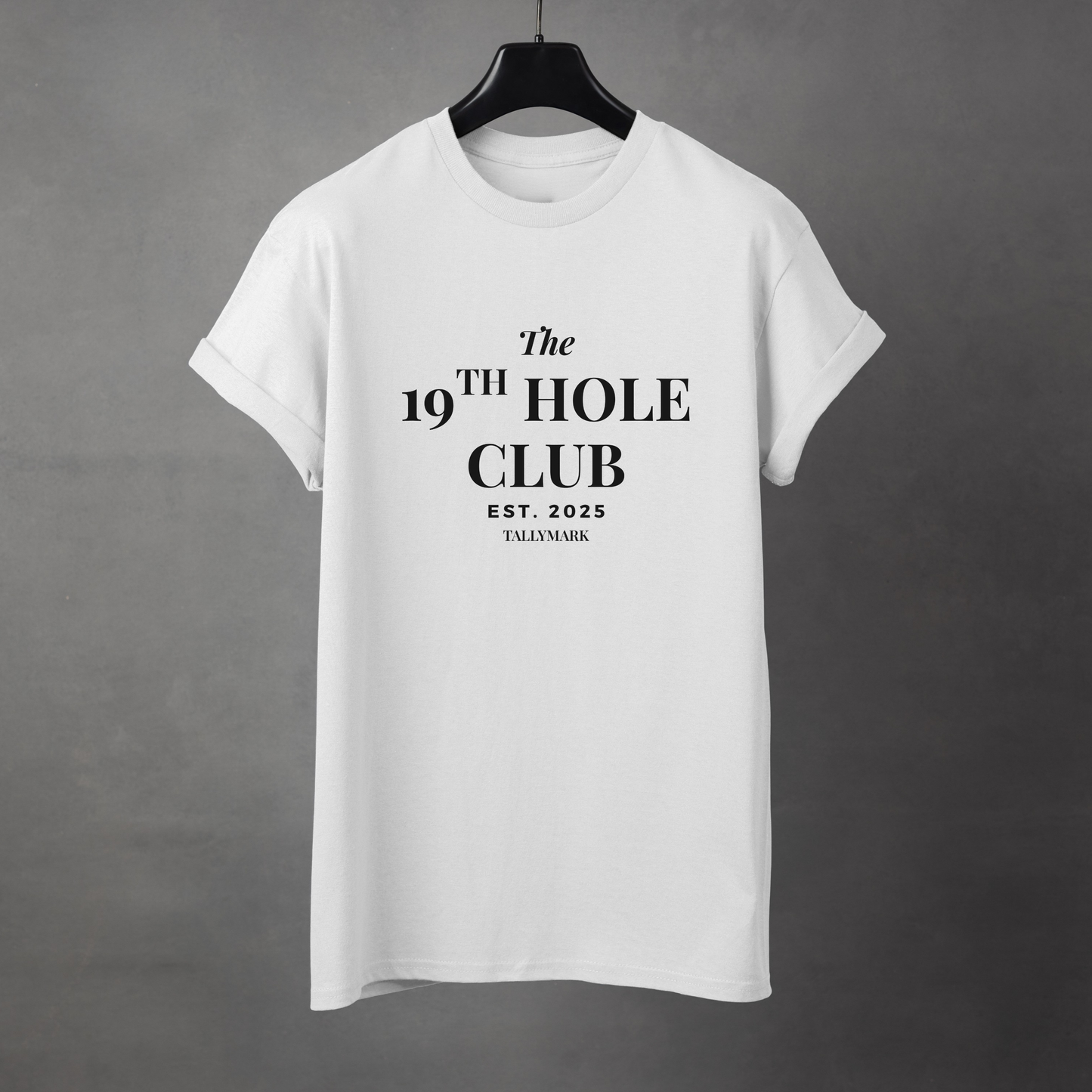 White t-shirt with "The 19th Hole Club" text against a dark background
