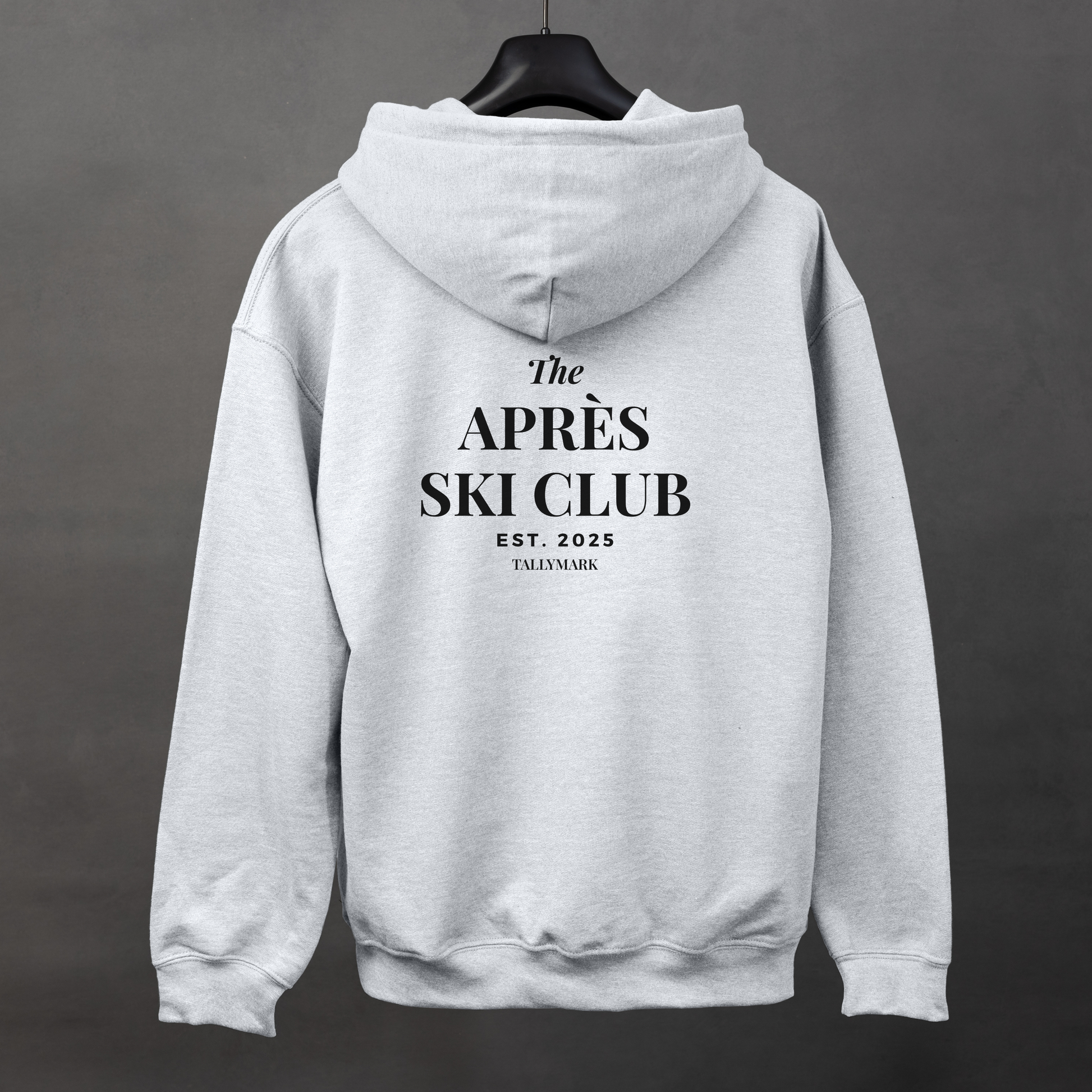 Gray hoodie with 'The Après Ski Club' text on the back against a dark background