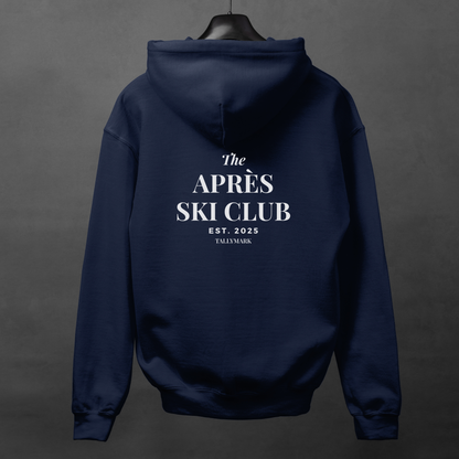 Navy blue hoodie with 'The Après Ski Club' text on the back against a dark background