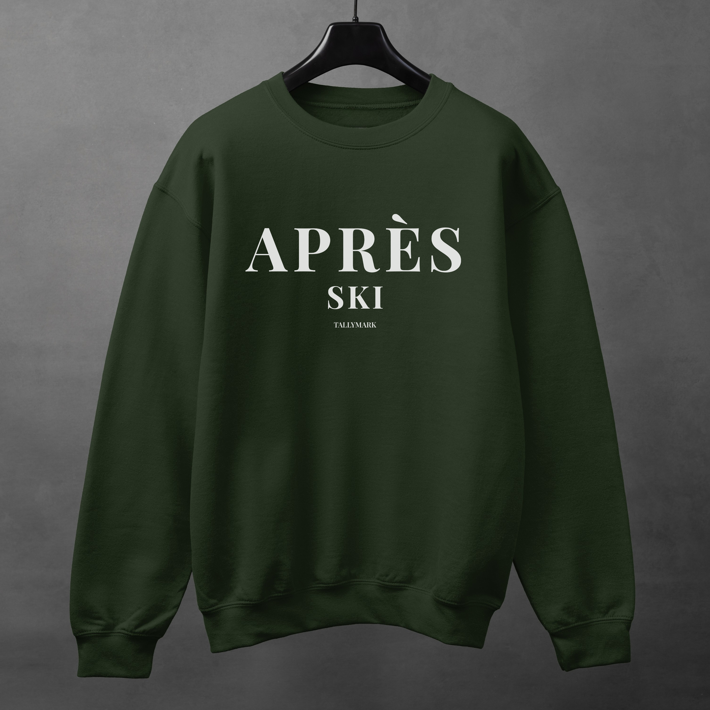 Green sweatshirt with 'Après Ski' text against a dark background