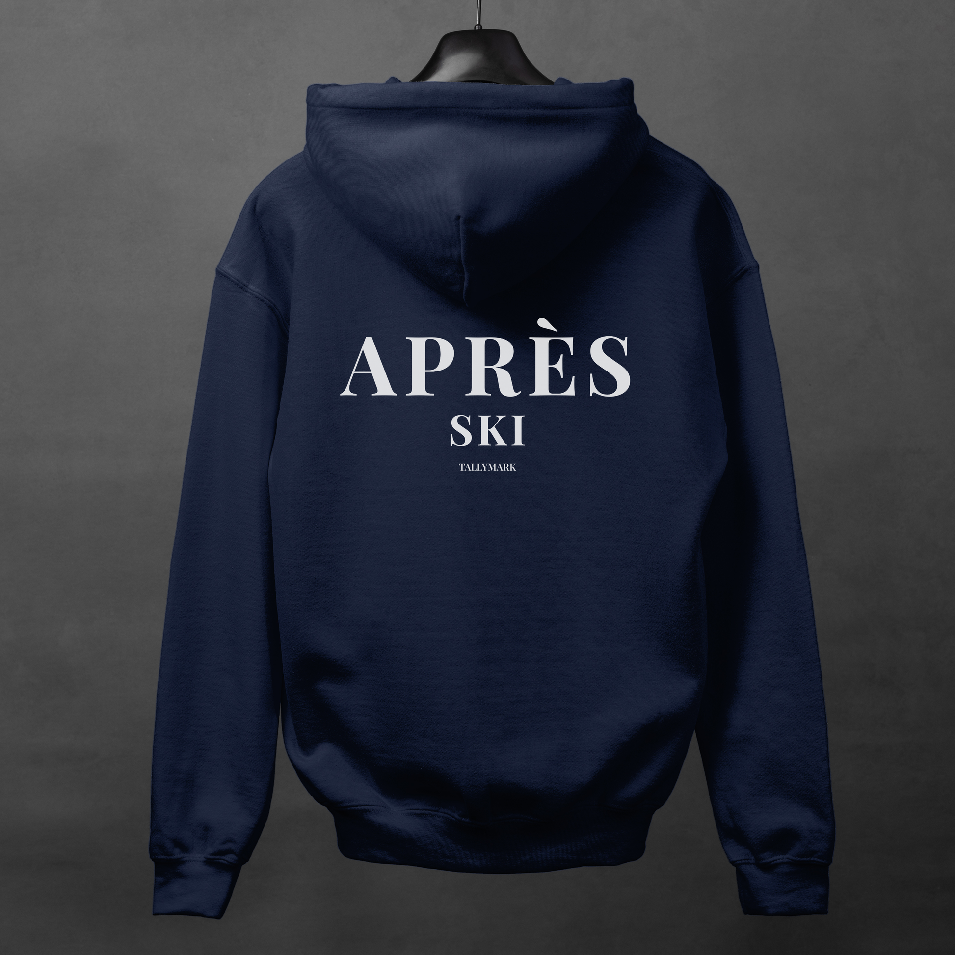 Navy blue hoodie with 'Après Ski' text on the back against a dark background
