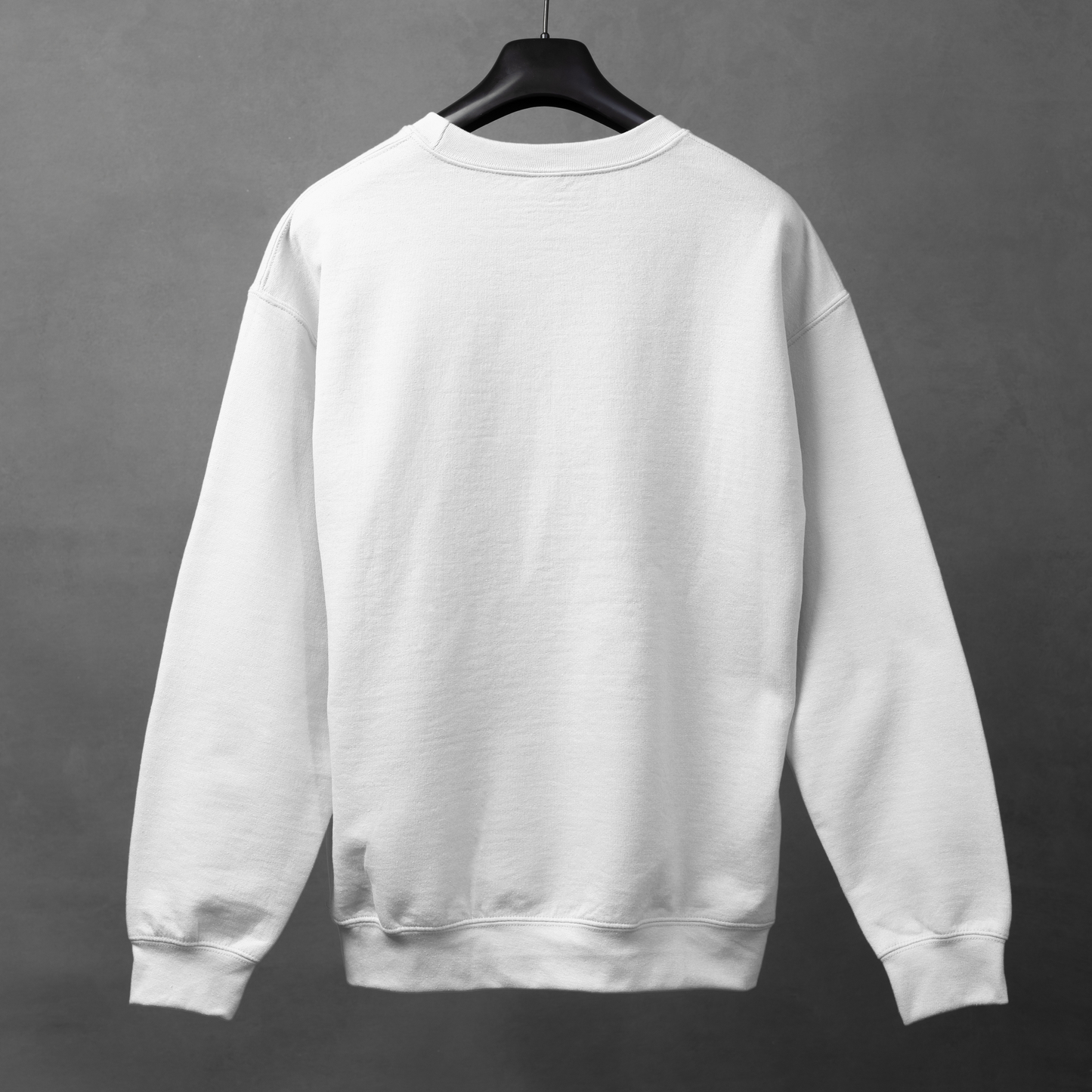 White sweatshirt on a hanger against a gray background