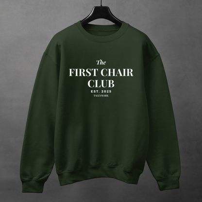 Green sweatshirt with 'The First Chair Club' text on a gray background