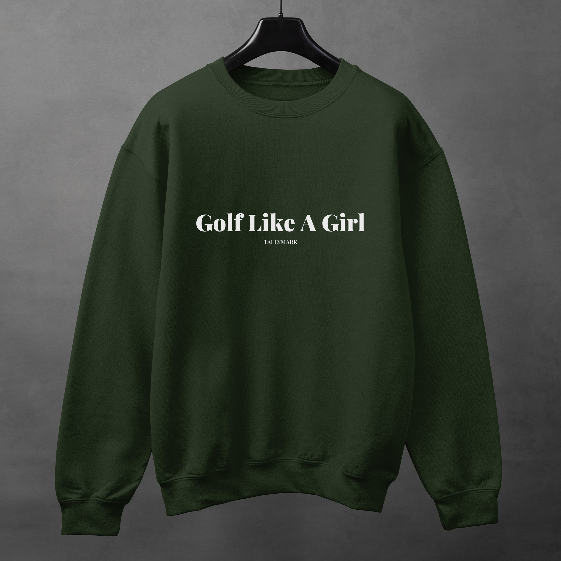 Green sweatshirt with 'Golf Like A Girl' text on a gray background