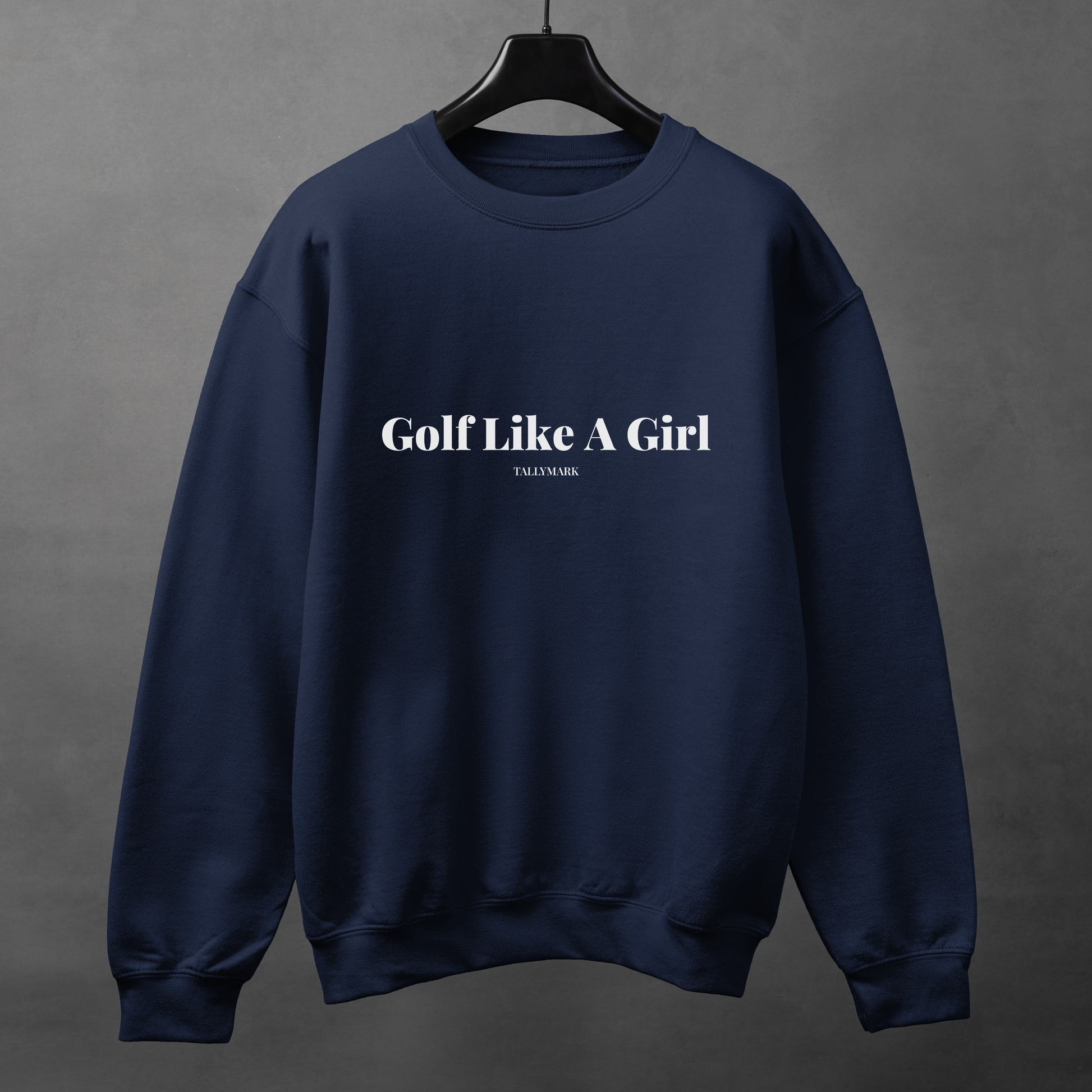 Navy blue sweatshirt with 'Golf Like A Girl' text on a gray background