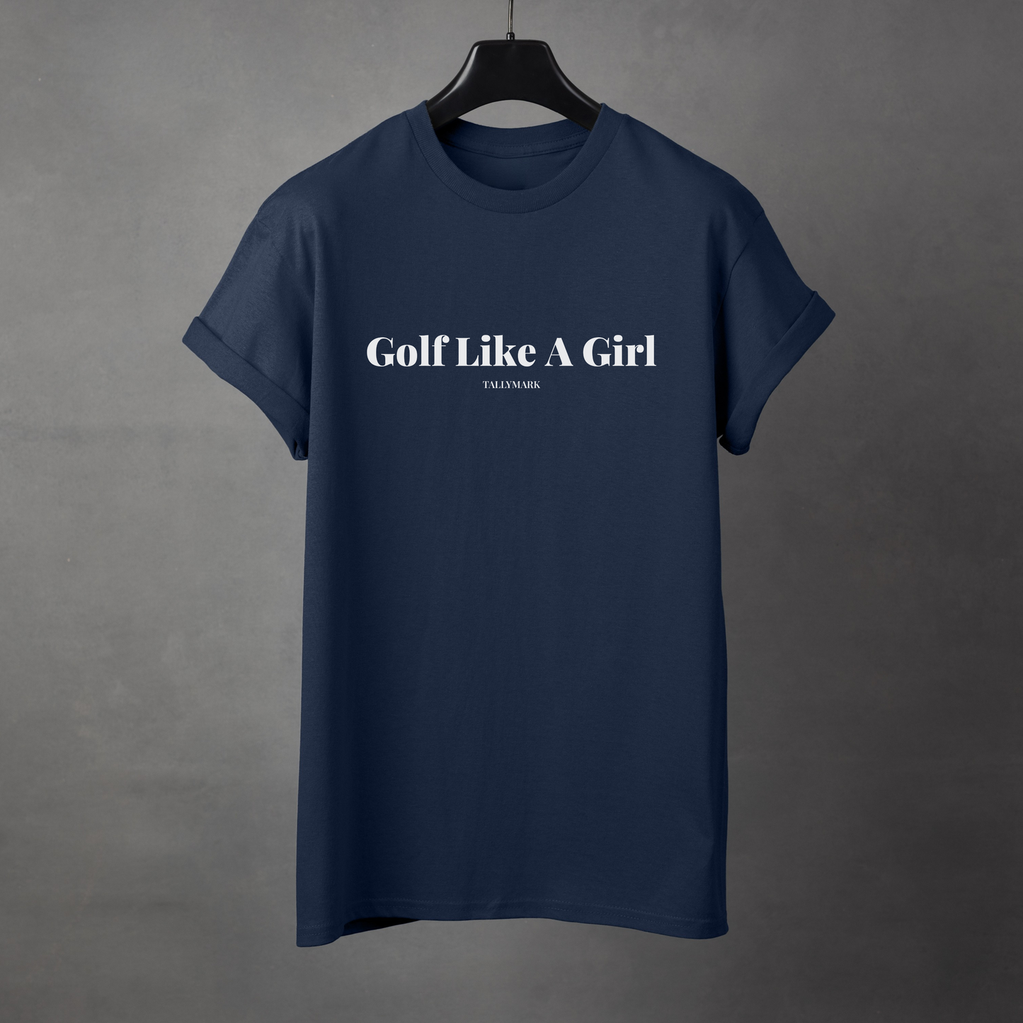 Navy blue t-shirt with 'Golf Like A Girl' text against a dark background
