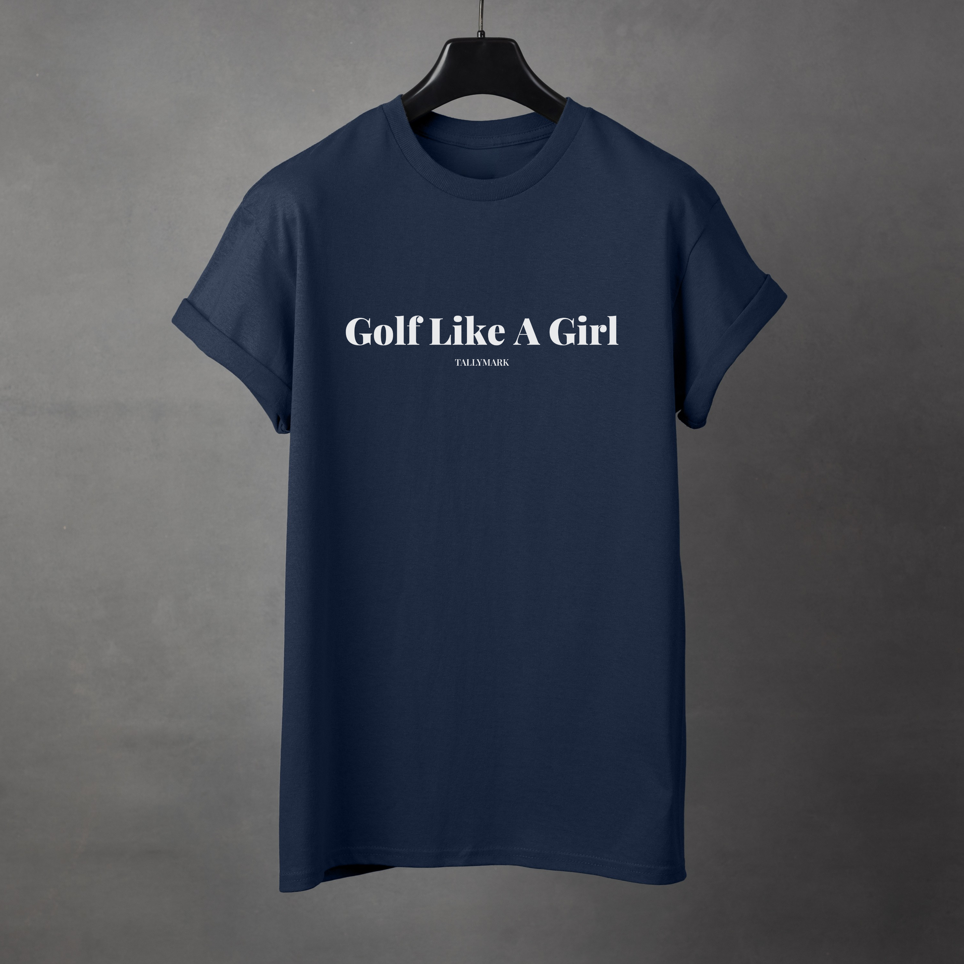 Navy blue t-shirt with 'Golf Like A Girl' text against a dark background