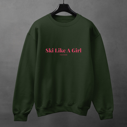 Green sweatshirt with pink 'Ski Like A Girl' text against a dark background