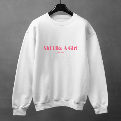 White sweatshirt with pink 'Ski Like A Girl' text against a dark background