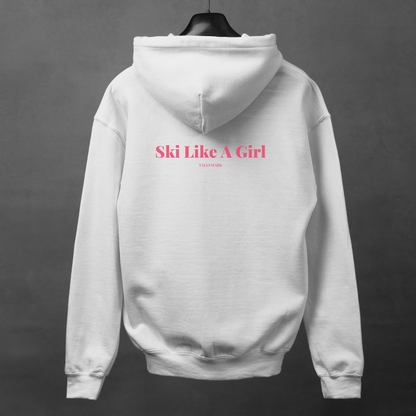 White hoodie with pink 'Ski Like A Girl' text on the back against a dark background