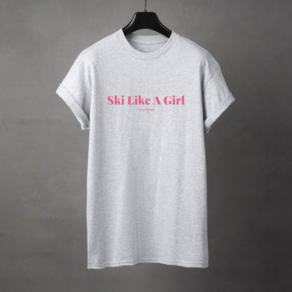 Gray t-shirt with pink 'Ski Like A Girl' text against a dark background
