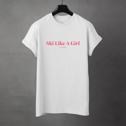 White t-shirt with pink 'Ski Like A Girl' text against a dark background
