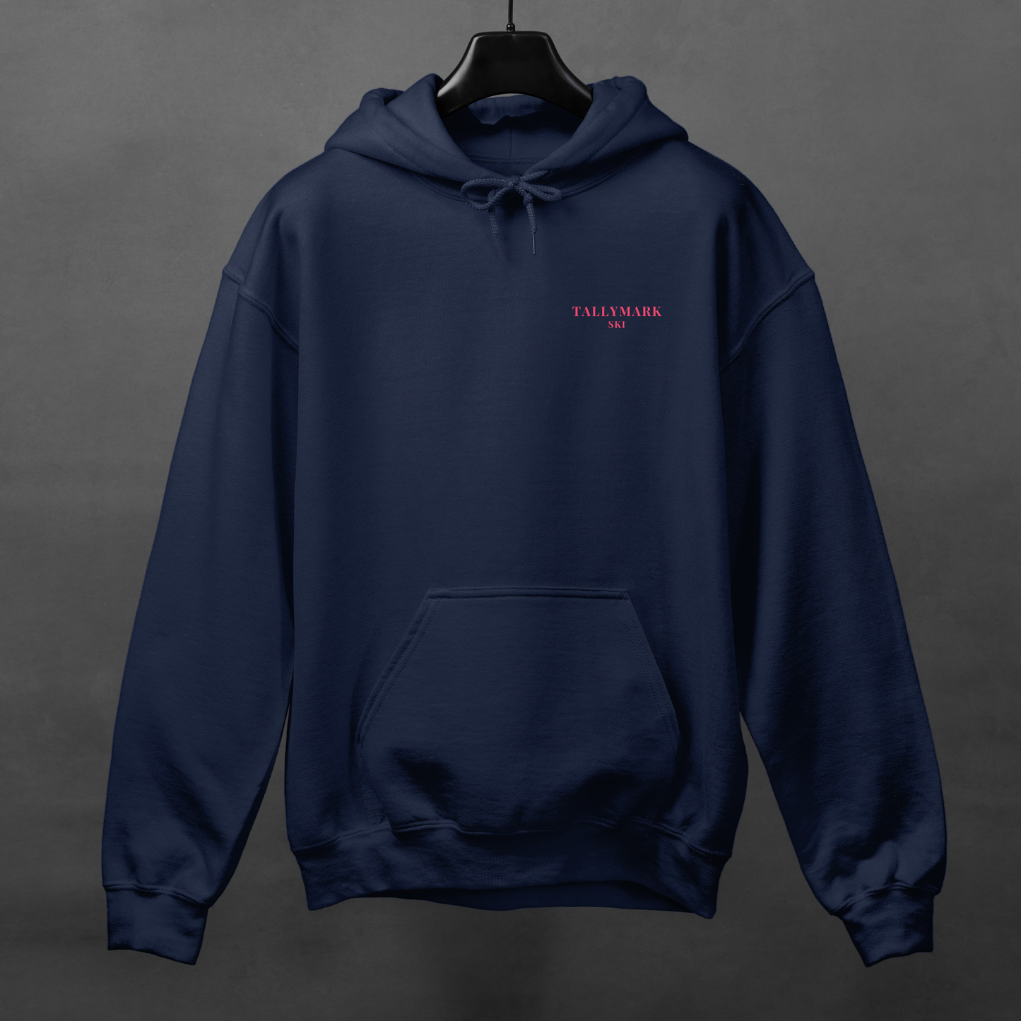 Navy blue hoodie with pink 'TALLYMARK SKI' logo on a gray background