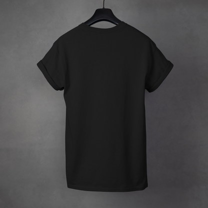 Black t-shirt on a hanger against a gray background