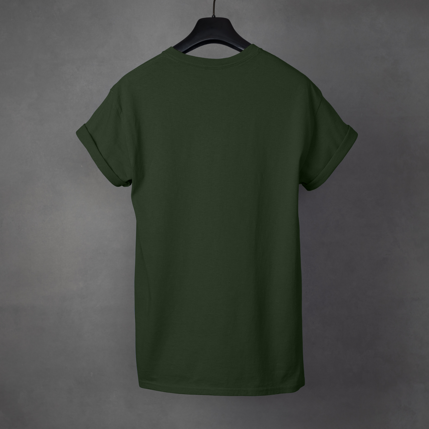 Green t-shirt on a hanger against a gray background