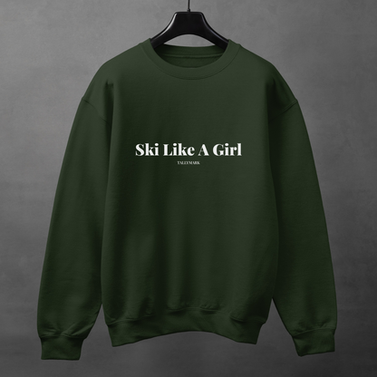 Green sweatshirt with 'Ski Like A Girl' text on a gray background