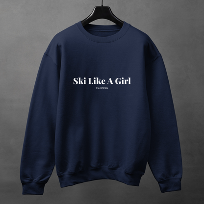Navy blue sweatshirt with 'Ski Like A Girl' text on a gray background