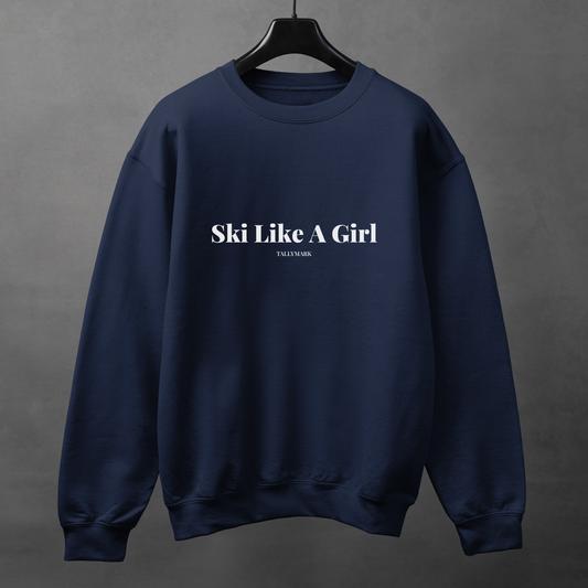 Navy blue sweatshirt with 'Ski Like A Girl' text on a gray background