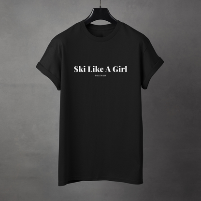 Black t-shirt with 'Ski Like A Girl' text on a gray background