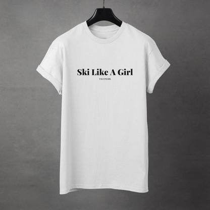 White t-shirt with 'Ski Like A Girl' text on a gray background